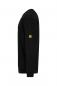 Preview: The picture shows a black long-sleeve shirt from a side view. It has a round neckline and a yellow patch on the left sleeve. The cut is simple and form-fitting.