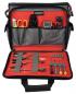Preview: The image displays an open tool bag with red lining. Inside the bag, various tools such as pliers, screwdrivers, scissors, and a multimeter are neatly arranged.