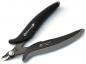 Preview: The image shows a combination pliers with black and gray, non-slip grips. The pliers have a sharp cutting edge and a joint in the middle to allow the opening movement.