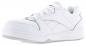 Preview: The shoe is a bright, white sneaker with a smooth surface. It has a round toe, flat laces, and a flexible rubber sole. The sides feature subtle stitching and markings.