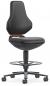Preview: The chair has a high, ergonomic back and a wide, padded seat. It stands on a swivel base with casters and a sturdy footrest. Color: Black.