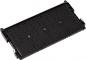 Preview: The image shows a black, rectangular component with several narrow grooves and slots. It has small protrusions on the sides and appears to be a storage or connecting element for technical devices.