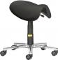 Preview: The chair has an oval, black seat without a backrest and is mounted on an adjustable, black column base. Five casters allow for easy movement. The base appears silver and shiny.