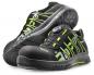 Preview: The image shows a pair of black work or sports shoes with green accents. They feature a sturdy rubber sole and an innovative quick-lace system.