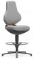 Preview: The chair has a high backrest and a padded seat in light gray. It stands on a sturdy, swivel base and has a round footrest. An orange accent is visible.