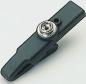 Preview: The image shows a black plastic clothespin. It is elongated and has a round metal spring at one end. The clip is intended for holding laundry.