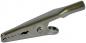 Preview: The image shows a silver metal clothespin. It has a curved shape with two gripping lips that can open and close, and a small spring in the middle.