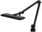 Preview: The image shows a black desk lamp with a flexible, flared arm. The lampshade is flat and elongated, mounted on a sturdy base.