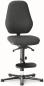 Preview: The chair has a black fabric cover and a high, ergonomic backrest. The seat is also black and mounted on a swivel base with five casters. There is a footrest.