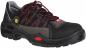 Preview: The image shows a sturdy work shoe. It is primarily black with gray and red design elements. The laces are red, and the shoe has a non-slip sole.