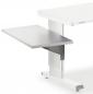 Preview: The image shows a modern, height-adjustable desk with a white tabletop. Below it is a silver, extendable tray table that is mounted on the side.