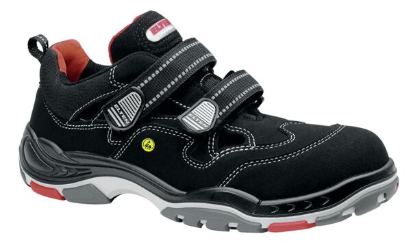 The shoe is dark blue, made from soft material with a reinforced sole. It has two wide, black Velcro straps and a padded insole for comfort.