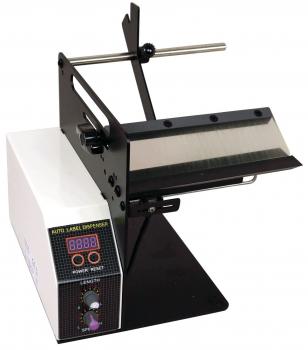 The image shows a label dispenser. It has a black top with a transparent area where labels are dispensed. On the side, there is a control panel with digital displays and buttons.