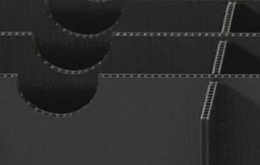 The image displays a structured, black surface with three round openings arranged in layers. The edges are wavy and appear to be made of a sturdy material.