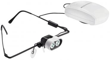 The image shows a special pair of glasses with two small, bright LED lights at the front. Attached to a cable is a white control unit. The glasses have black arms.