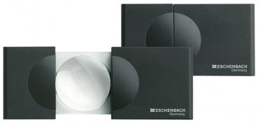 The image shows two black reading aids. A large, round lens is visible in the center, surrounded by two rectangular housings. They are compact and portable, ideal for reading.