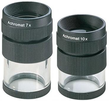 The image shows a black magnifying glass. The top has the inscription 