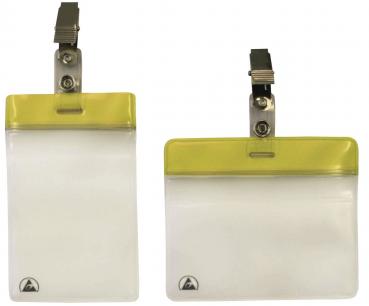 The image displays a transparent name tag with a yellow top border and a metal clip for attachment. It features a rectangular shape and a smooth surface.