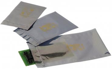 The image shows three silver, shiny packages in different sizes, slightly offset from each other. The front features a golden pattern or logo.
