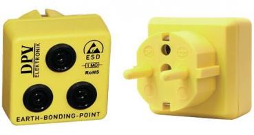 The image shows a yellow grounding plug with three round sockets on the front and a round plug connection on the side. Labels are visible.