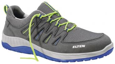 The shoe is gray with blue and green accents. It has a sporty design, a flat sole, and a padded surface. The shoelaces are bright green.