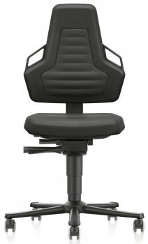 The office chair has a high backrest with a modern, triangular shape. It is black and has a padded seat. The armrests are attached to the sides. The chair has casters.