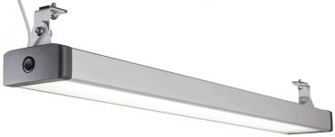 This is a long, narrow light fixture in silver with a matte, bright strip of light. It is attached to two brackets that are mounted on the ceiling or wall.