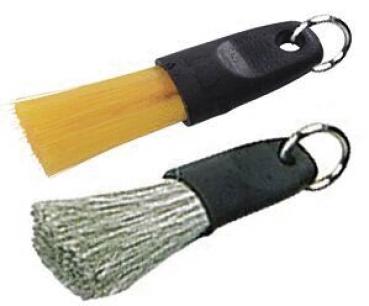 The image displays a small brush with a yellow brush head and a black handle. Attached to the end of the handle is a ring, likely for hanging.