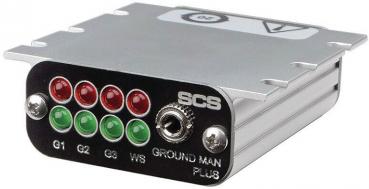 The image shows a compact, rectangular device with a silver casing. On the front, there are five LED lights (red and green) and a rotary knob. Below it reads 