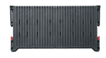 The image shows a rectangular, gray container with vertical grooves. There are red elements at the corners. The surface texture is uniform and sturdy.