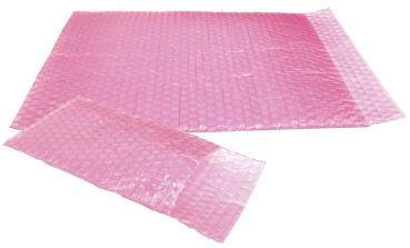 Das Bild zeigt eine große, rechteckige Luftpolsterfolie in leuchtendem Rosa. Die Oberfläche ist mit vielen kleinen, runden Luftbläschen bedeckt, die nach dem Drücken ein Geräusch erzeugen.