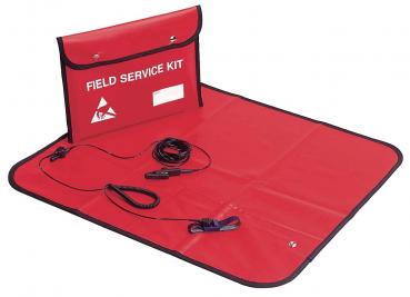 The image shows a red field service kit. It is folded with a fold-out pouch. Inside, cables and accessories are visible, lying on a flat, red surface.