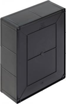 The image shows a black, rectangular box with rounded corners and a smooth surface. On the front, there is a square flap in the middle.