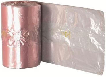 The image shows a roll of pink plastic wrap lying on the left side, and next to it a spread-out transparent film. Both are shiny and smooth.