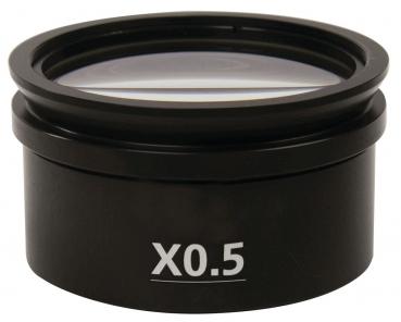 The image displays a black lens with a diameter of about 7 cm. On the front, it is labeled "X0.5". The lens is mounted on a round casing.