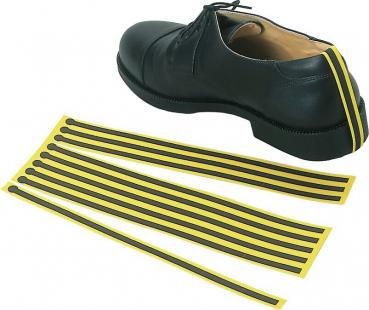 The image shows a black shoe with laces. Next to it are several yellow and black stretch bands that serve as alternative laces.