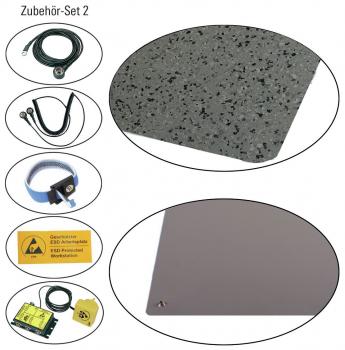 The image displays an accessory kit consisting of various items: a gray cable, a black cable, a gray speckled mat, a safety instruction, and other components in oval shapes.