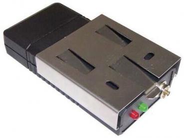 The image shows an electronic device with a black plastic casing and a silver metal front. On the front, there are two slots and two light indicators: one green and one red.