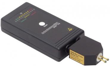 The image displays a black rectangular electric testing device with a plug. At the top, colorful LEDs and a pressed button are visible. It is used for checking electrical connections.