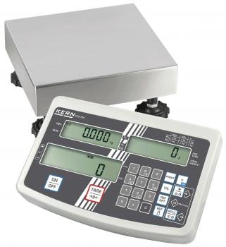 The image shows a digital scale with a rectangular platform made of shiny metal on top and a control unit below. The control unit has two displays and numerous buttons.