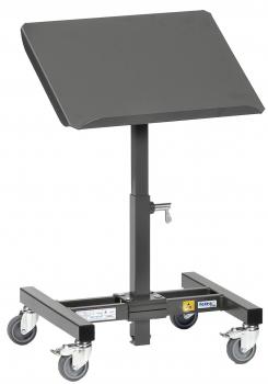The image shows a mobile, adjustable table on wheels. The tabletop is slanted and rectangular, the stand is black and can be adjusted in height.