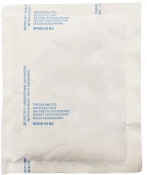 The image shows a beige packaging pouch with the inscription in blue font: "Trockenmittel", "Desiccant Bag", and other languages. The surface is smooth and solid-colored.