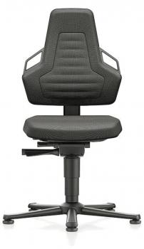 The office chair is black and features an ergonomic backrest with cutouts. The seat is padded, and the chair has casters as well as a height adjustment.