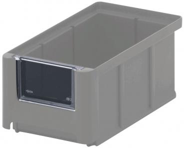 The image shows a rectangular, gray plastic box with an open top edge. On the front, there is a small, black labeling area. The box has straight edges and is sturdy.