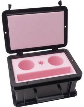 The image shows a black, lockable box with a pink interior. Inside, there are two round cutouts and an elongated area, likely for storing devices or accessories.