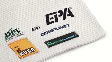 The image displays a textile name tag with a gray background and the bolded name 
