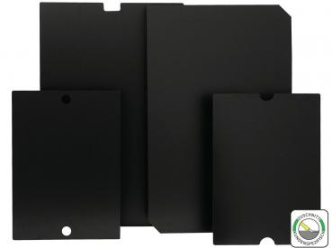 The image shows four black plates of different sizes and shapes, arranged on top of each other. Some have notches on the edges to facilitate handling.