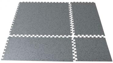 The image shows a square, gray mat with a textured surface and jagged edges, which are designed for easy connection with other mats. It is durable and versatile.