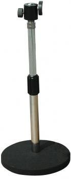 The image shows a microphone stand. It has a round, heavy base for stability, a tall, adjustable metal rod with a screw head on top to hold a microphone.
