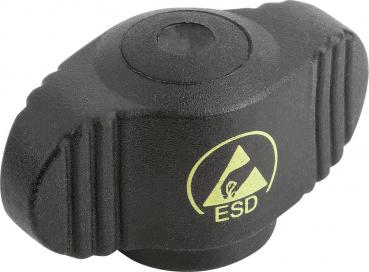 The image shows a black ESD hand switch. It has an oval shape with lateral elevations and a central, circular button. A yellow symbol with the text "ESD" is clearly visible.